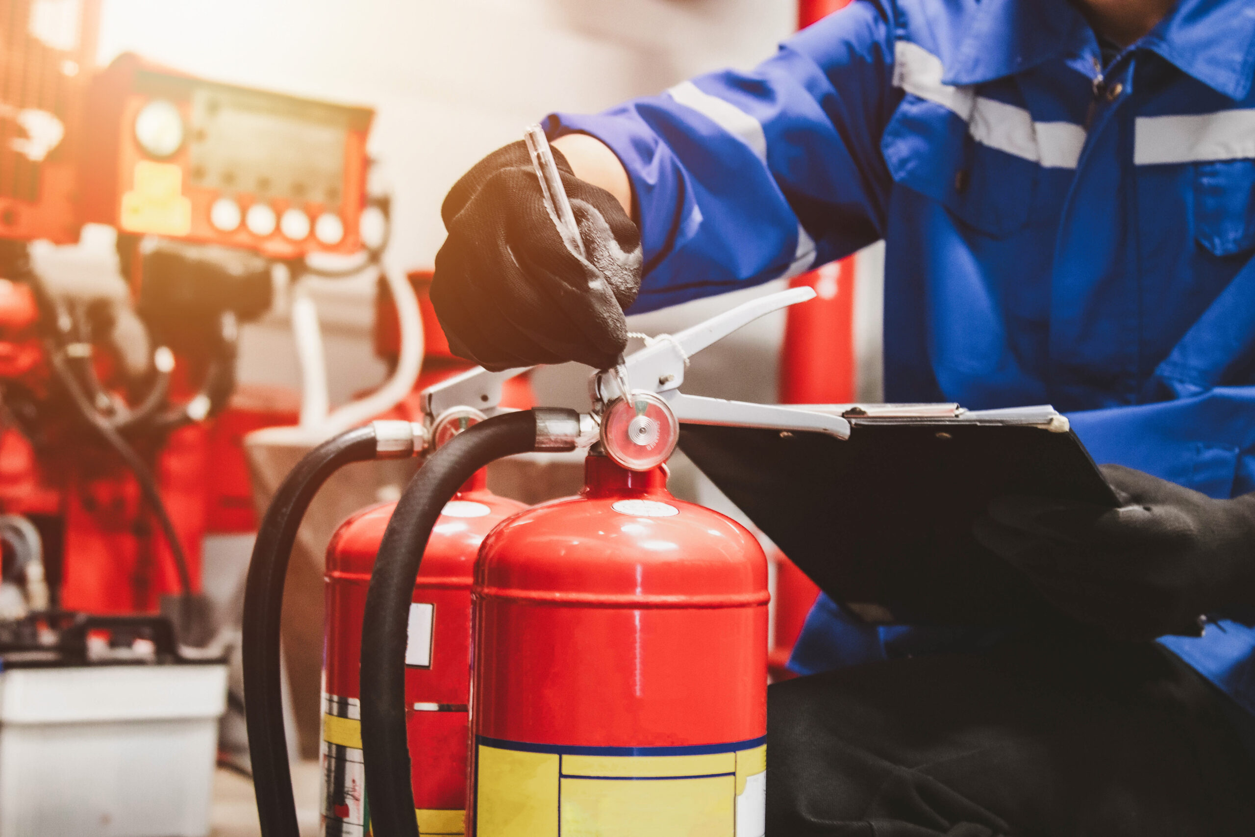 Technician Inspecting Fire Extinguishers